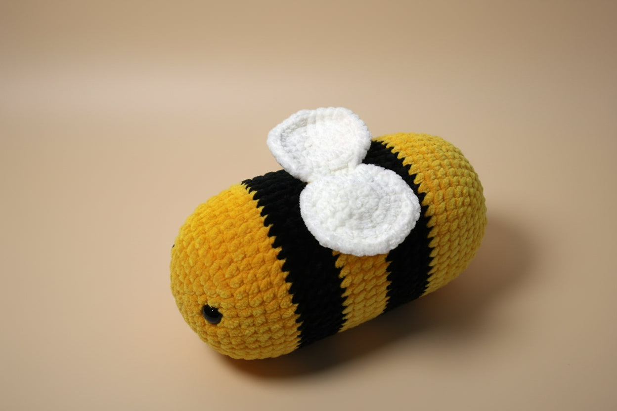 Handmade crochet bee from the amigurumi collection of the baseline handicraft, crafted in France with love.