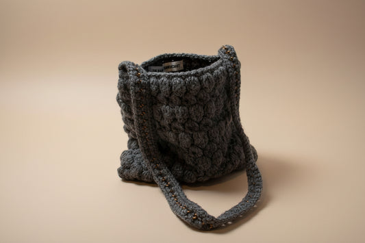 Handmade crochet mini pouch purse from the wearables bag collection of the baseline handicraft, crafted in France with love.