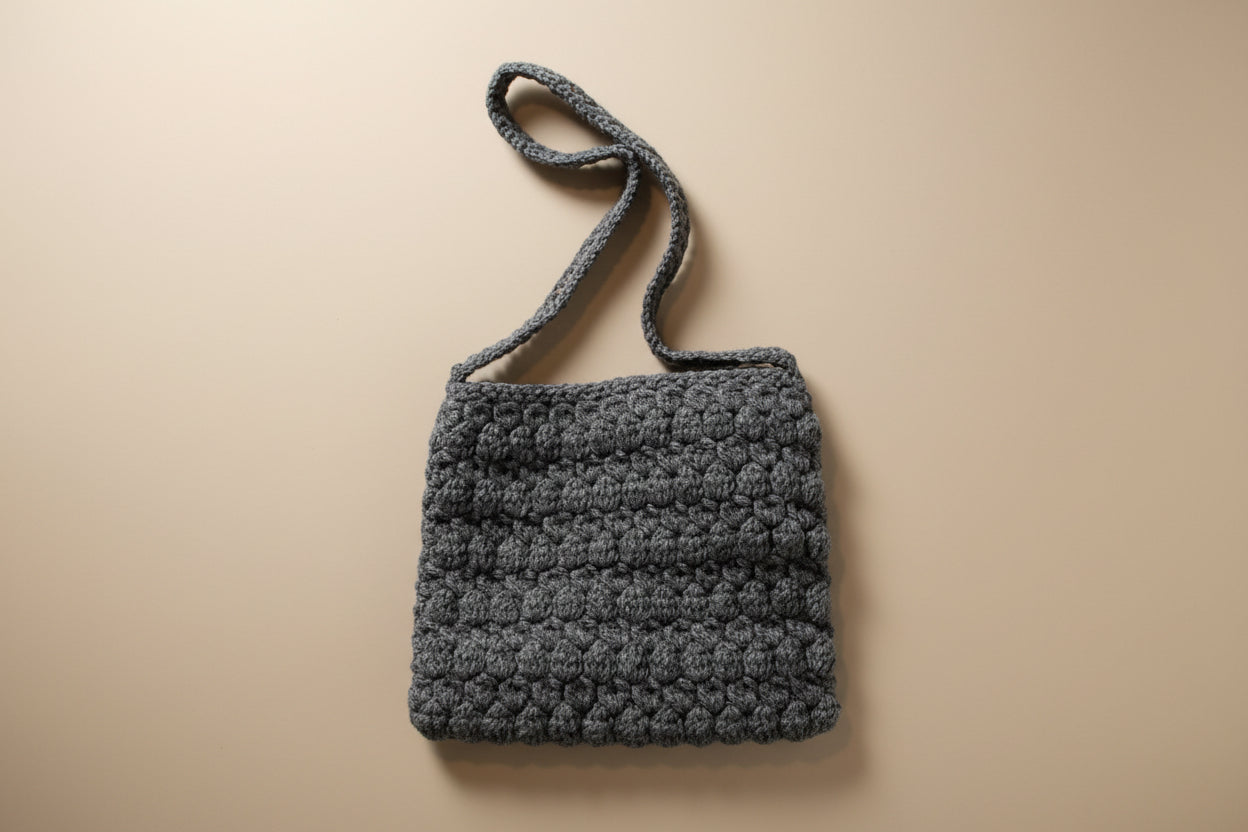 Handmade crochet mini pouch purse from the wearables bag collection of the baseline handicraft, crafted in France with love.