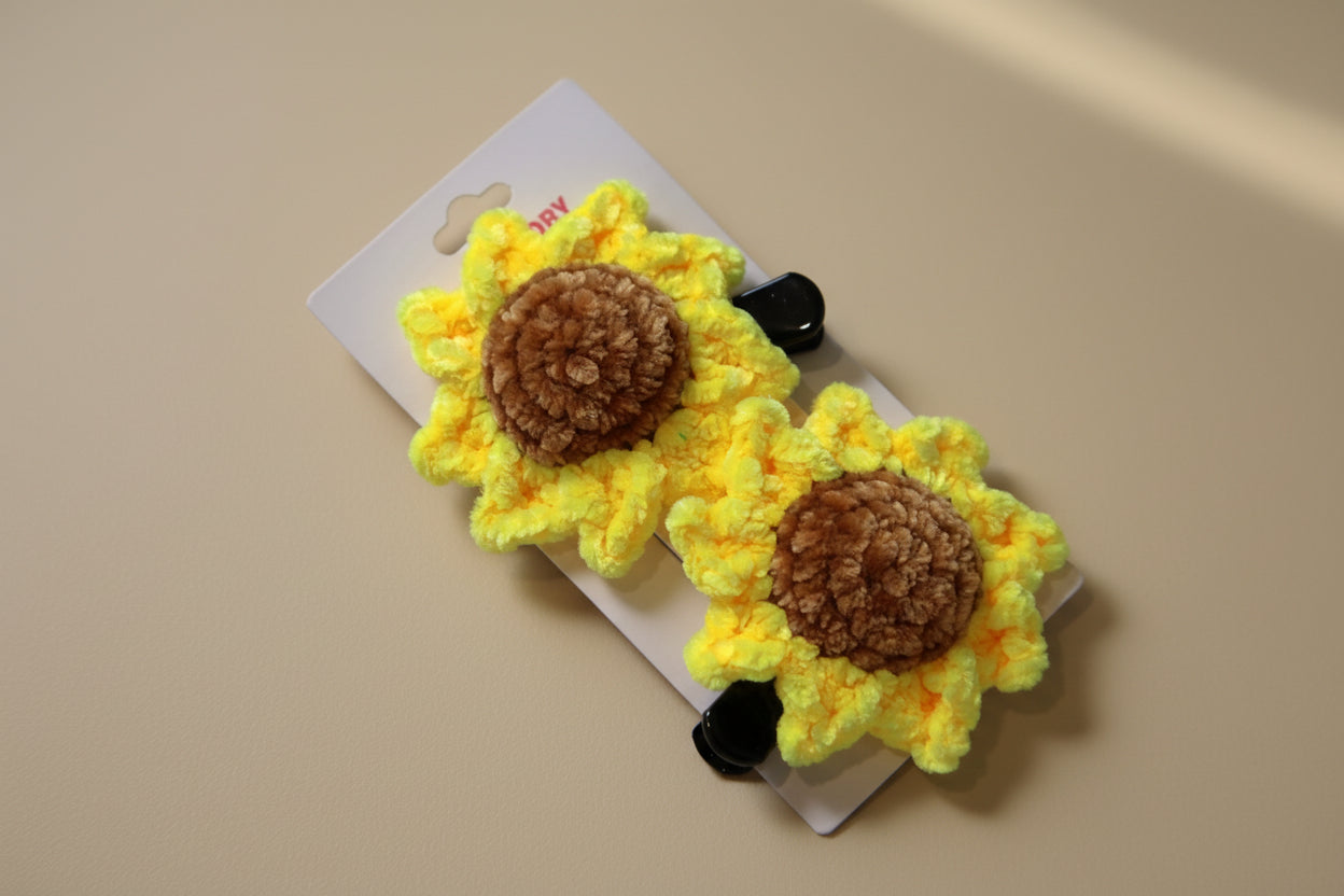 Handmade crochet sunflower hair clip from the wearable collection of the baseline handicraft, crafted in France with love.