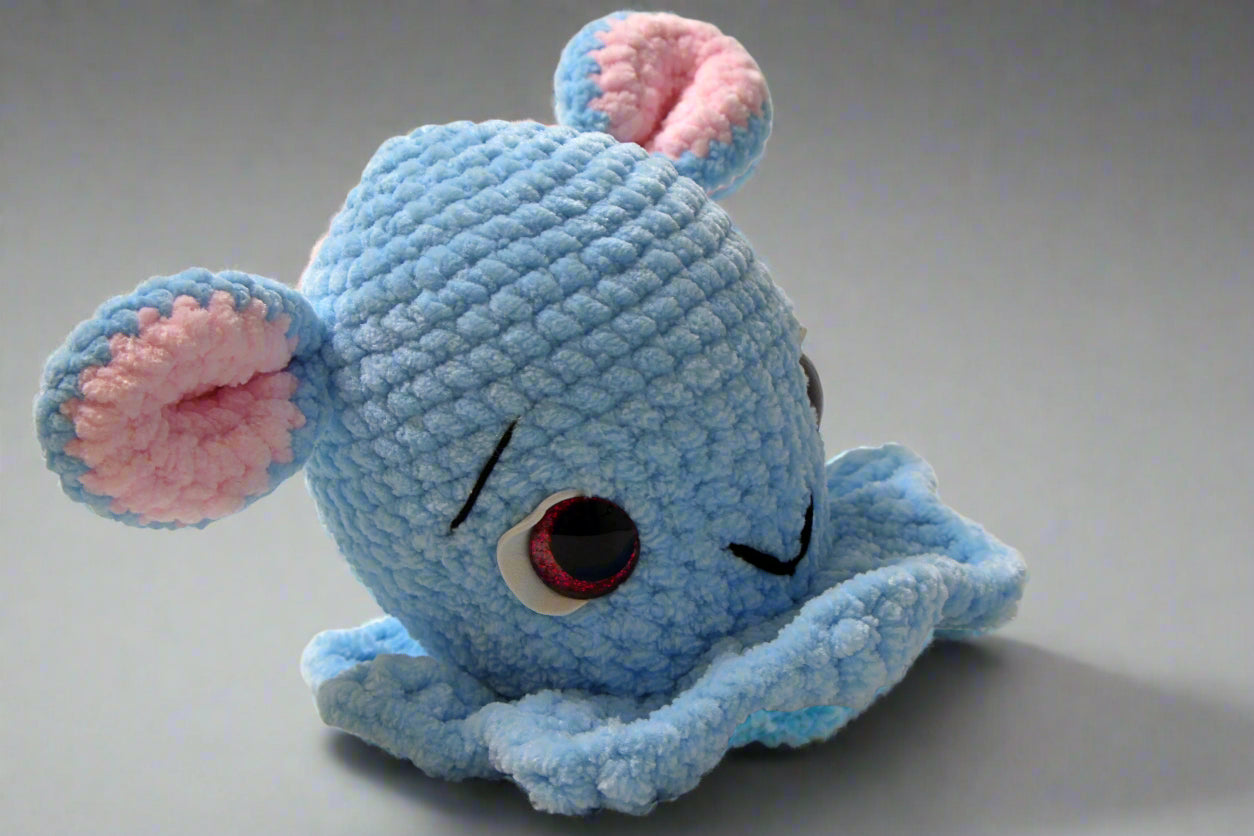 Handmade crochet Dumbo the octopus from the amigurumi marine collection of the baseline handicraft, crafted in France with love. 
