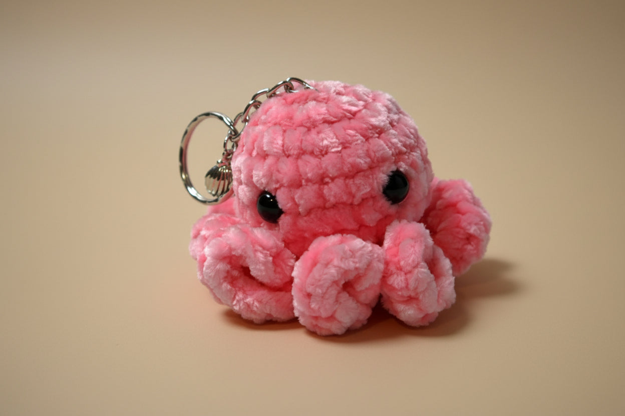 Handmade crochet keychain mini octopus from the amigurumi marine life collection of the baseline handicraft, crafted in France with love. 