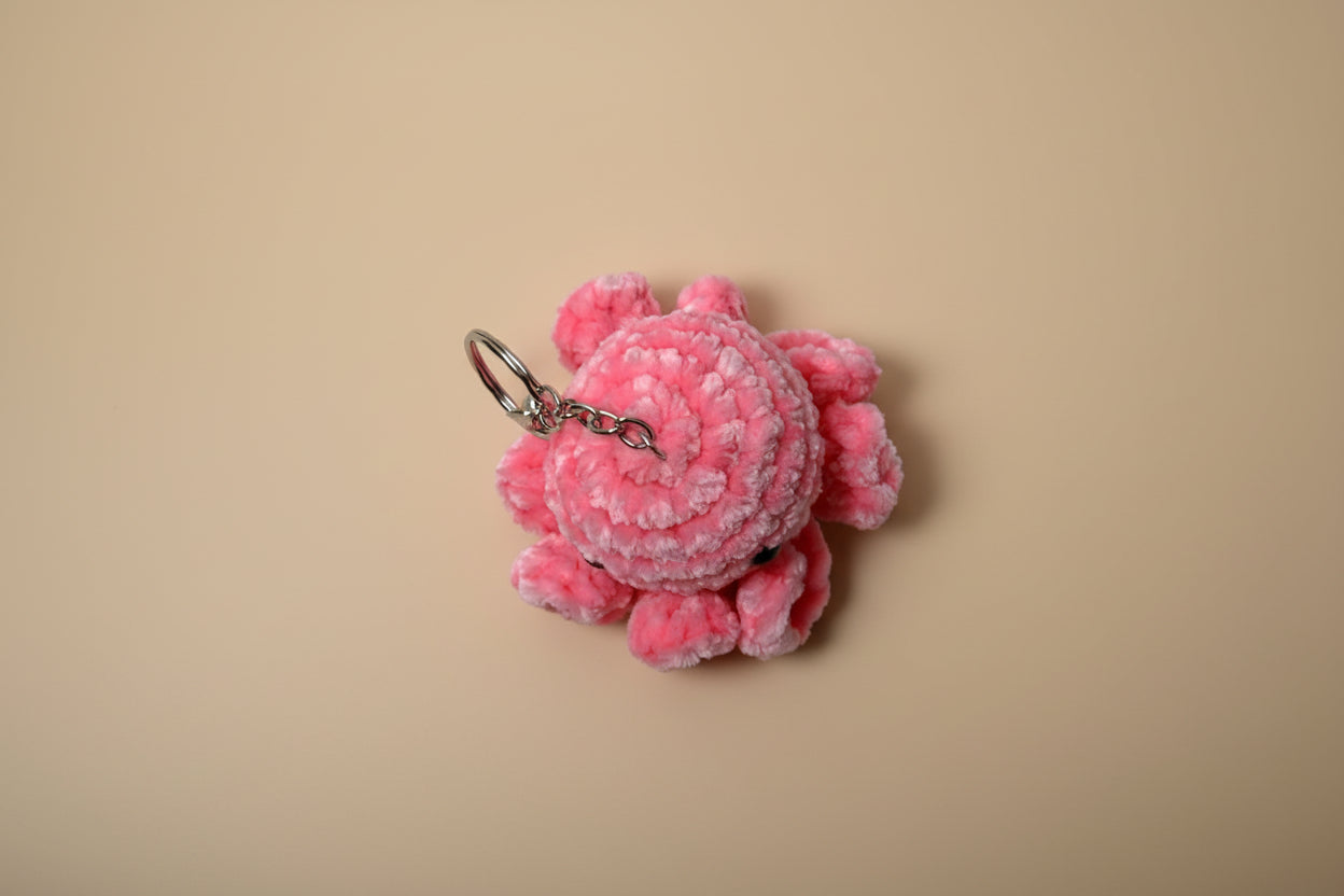 Handmade crochet keychain mini octopus from the amigurumi marine life collection of the baseline handicraft, crafted in France with love. 