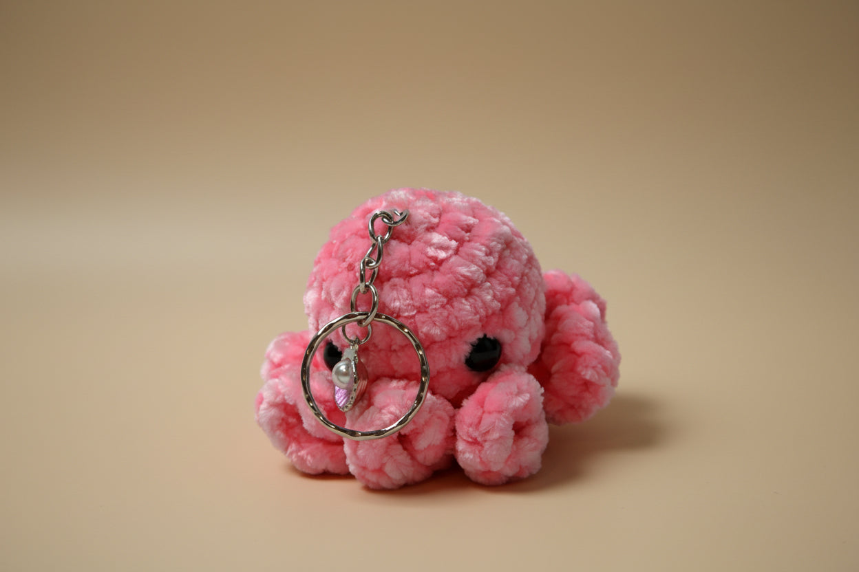 Handmade crochet keychain mini octopus from the amigurumi marine life collection of the baseline handicraft, crafted in France with love. 
