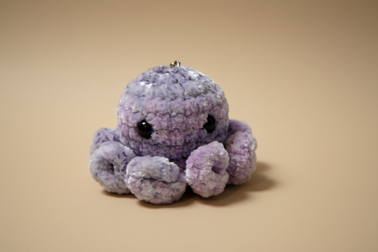 Handmade crochet keychain mini octopus from the amigurumi marine life collection of the baseline handicraft, crafted in France with love. 