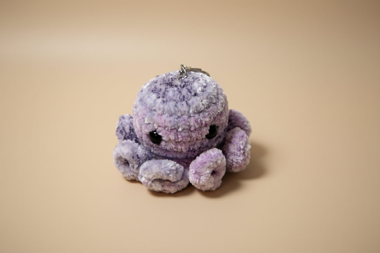 Handmade crochet keychain mini octopus from the amigurumi marine life collection of the baseline handicraft, crafted in France with love. 
