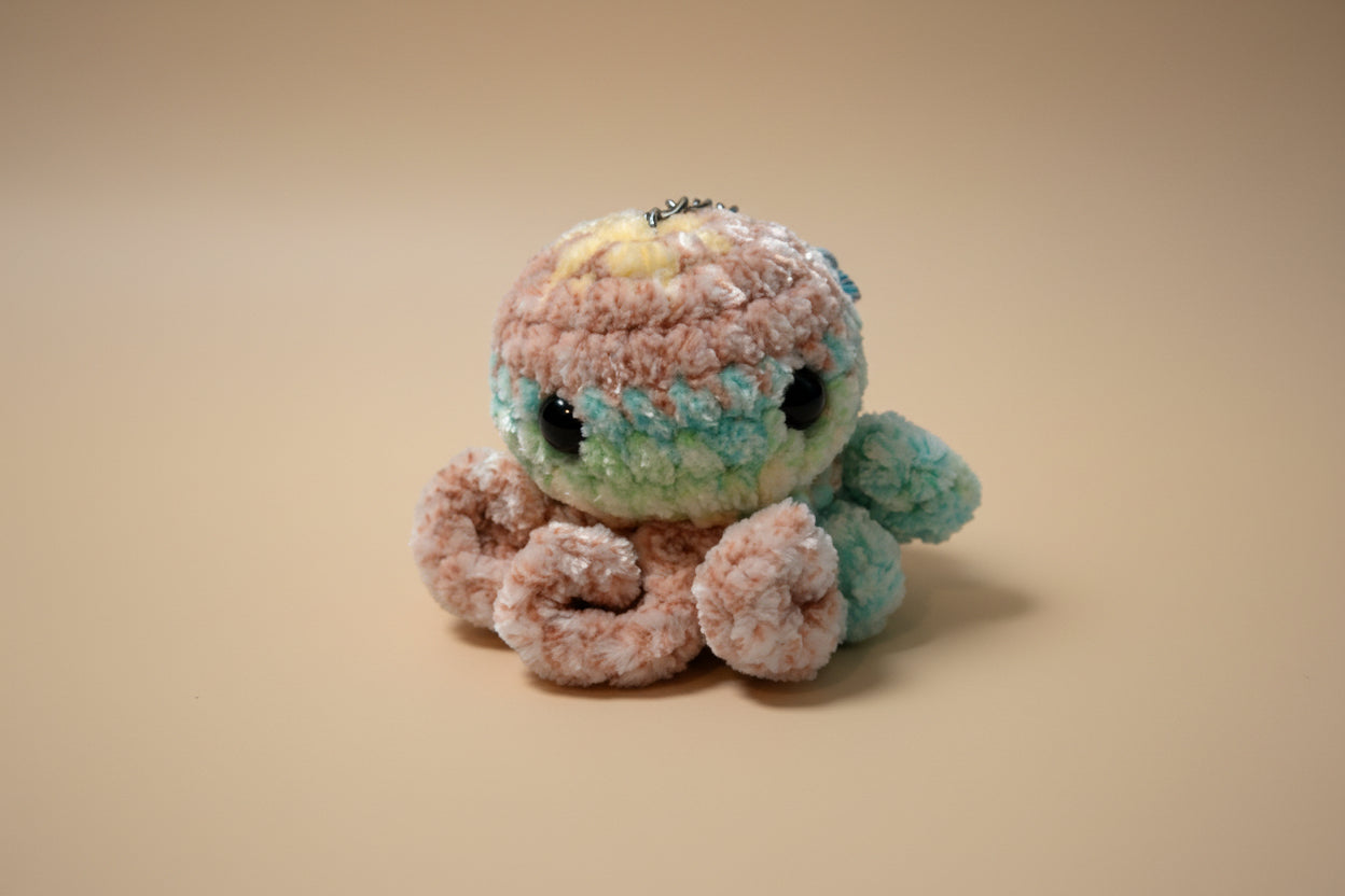 Handmade crochet keychain mini octopus from the amigurumi marine life collection of the baseline handicraft, crafted in France with love. 