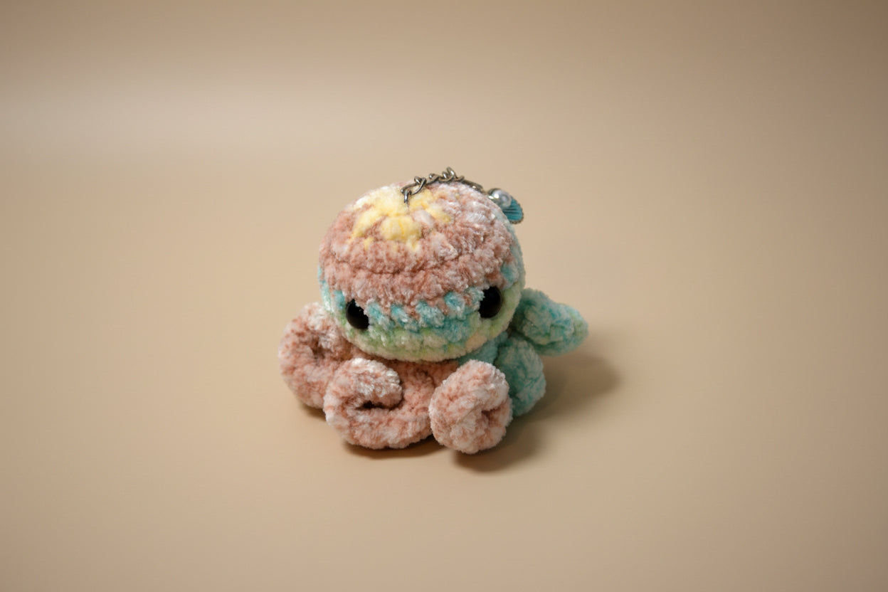 Handmade crochet keychain mini octopus from the amigurumi marine life collection of the baseline handicraft, crafted in France with love. 