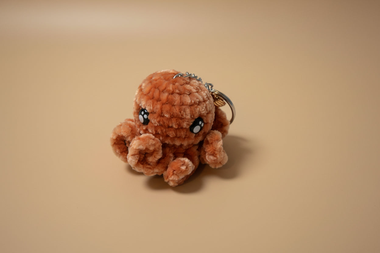 Handmade crochet keychain octopus from the amigurumi marine life collection of the baseline handicraft, crafted in France with love. 