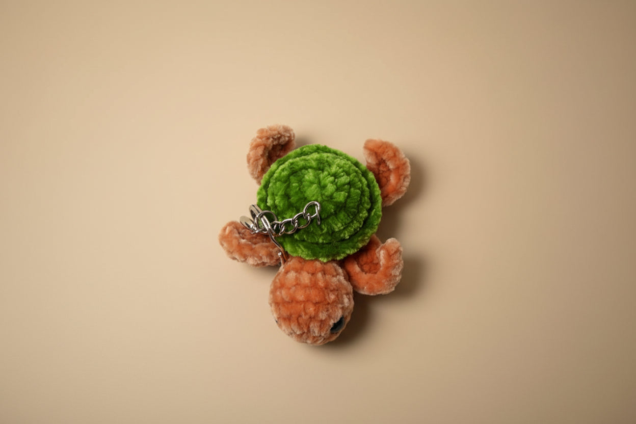 Handmade crochet keychain turtle from the marine life collection of the baseline handicraft, crafted in France with love. 