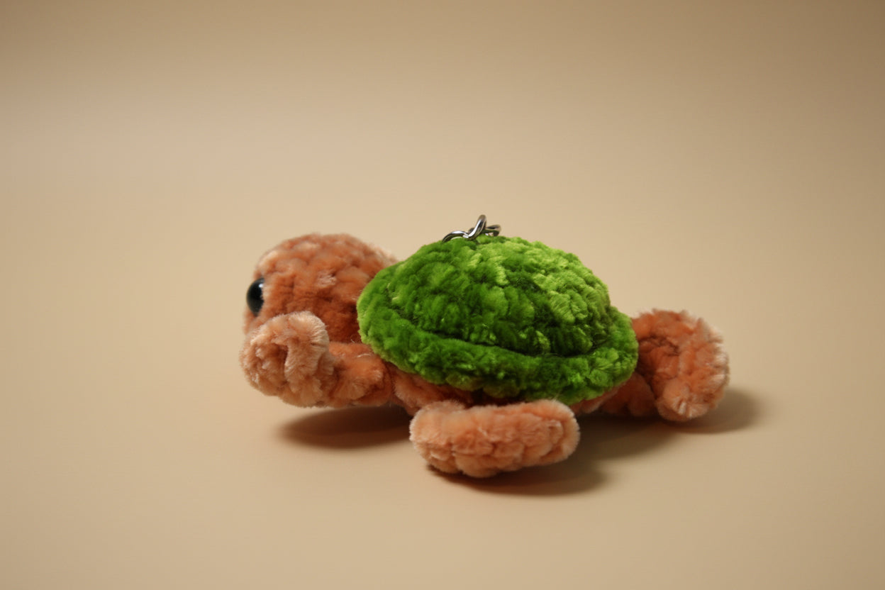 Handmade crochet keychain turtle from the marine life collection of the baseline handicraft, crafted in France with love. 