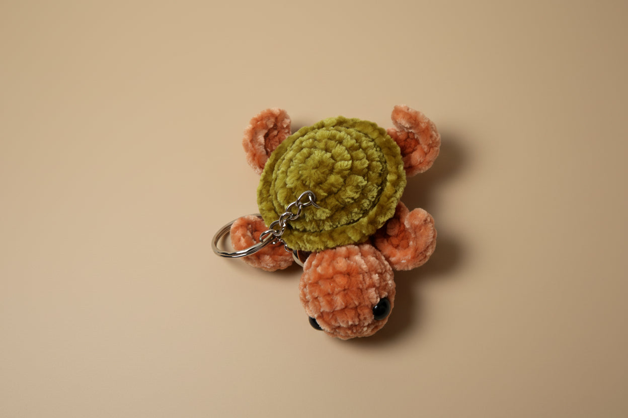 Handmade crochet keychain turtle from the marine life collection of the baseline handicraft, crafted in France with love. 