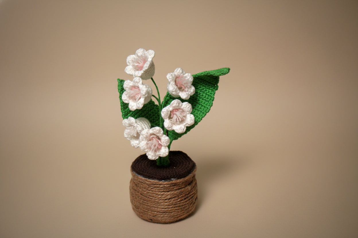 Handmade crochet lily of the valley from the crocheted flower collection, crafted in France.