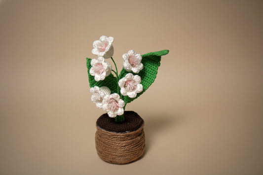 Handmade crochet lily of the valley from the crocheted flower collection, crafted in France.