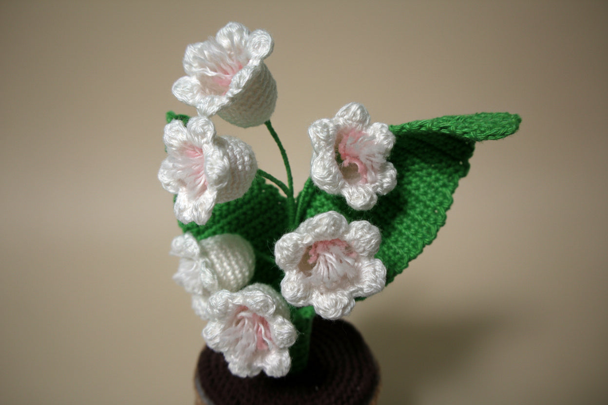 Handmade crochet lily of the valley from the crocheted flower collection, crafted in France.