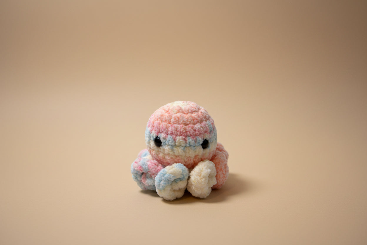 Handmade crochet little octopus desk charm from the amigurumi marine life collection of the baseline handicraft, crafted in France with love. 