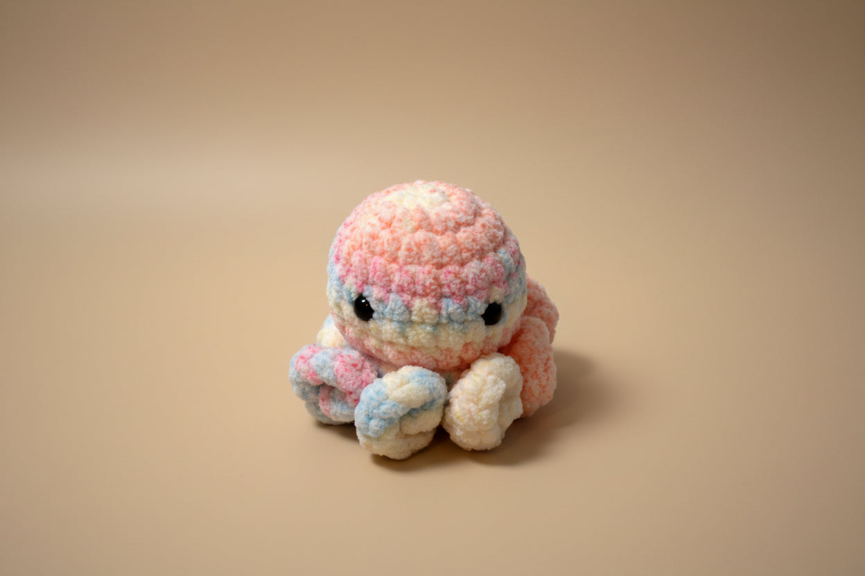 Handmade crochet little octopus desk charm from the amigurumi marine life collection of the baseline handicraft, crafted in France with love. 
