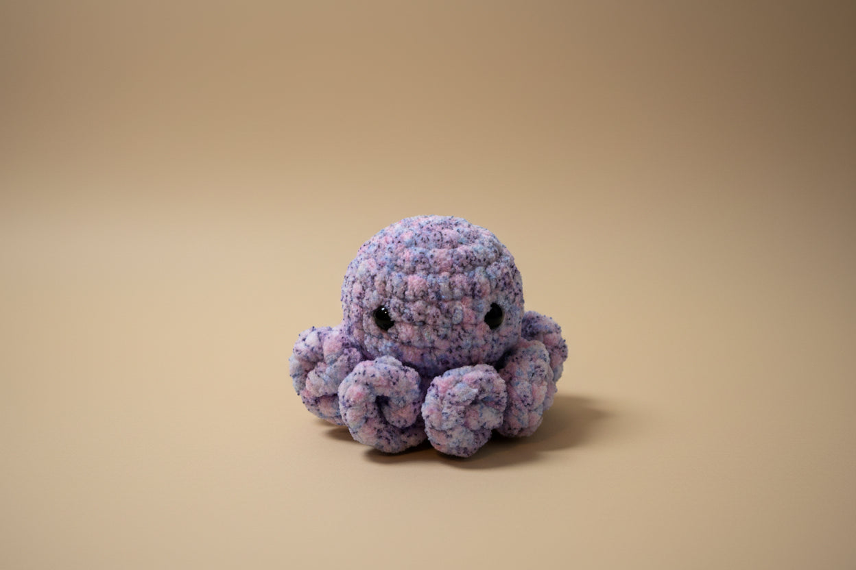 Handmade crochet little octopus desk charm from the amigurumi marine life collection of the baseline handicraft, crafted in France with love. 