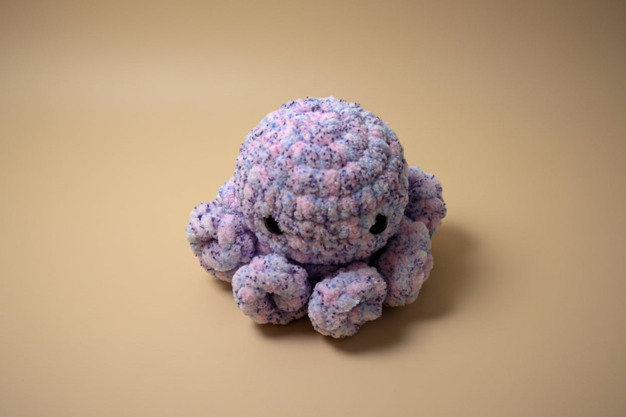 Handmade crochet little octopus desk charm from the amigurumi marine life collection of the baseline handicraft, crafted in France with love. 
