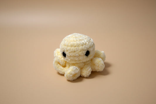 Handmade crochet mini octopus desk charm from the amigurumi marine life collection of the baseline handicraft, crafted in France with love. 