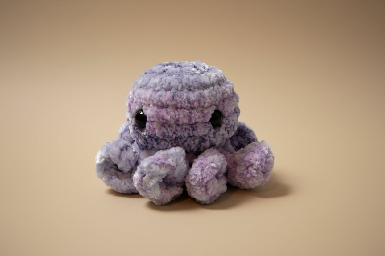 Handmade crochet mini octopus desk charm from the amigurumi marine life collection of the baseline handicraft, crafted in France with love. 