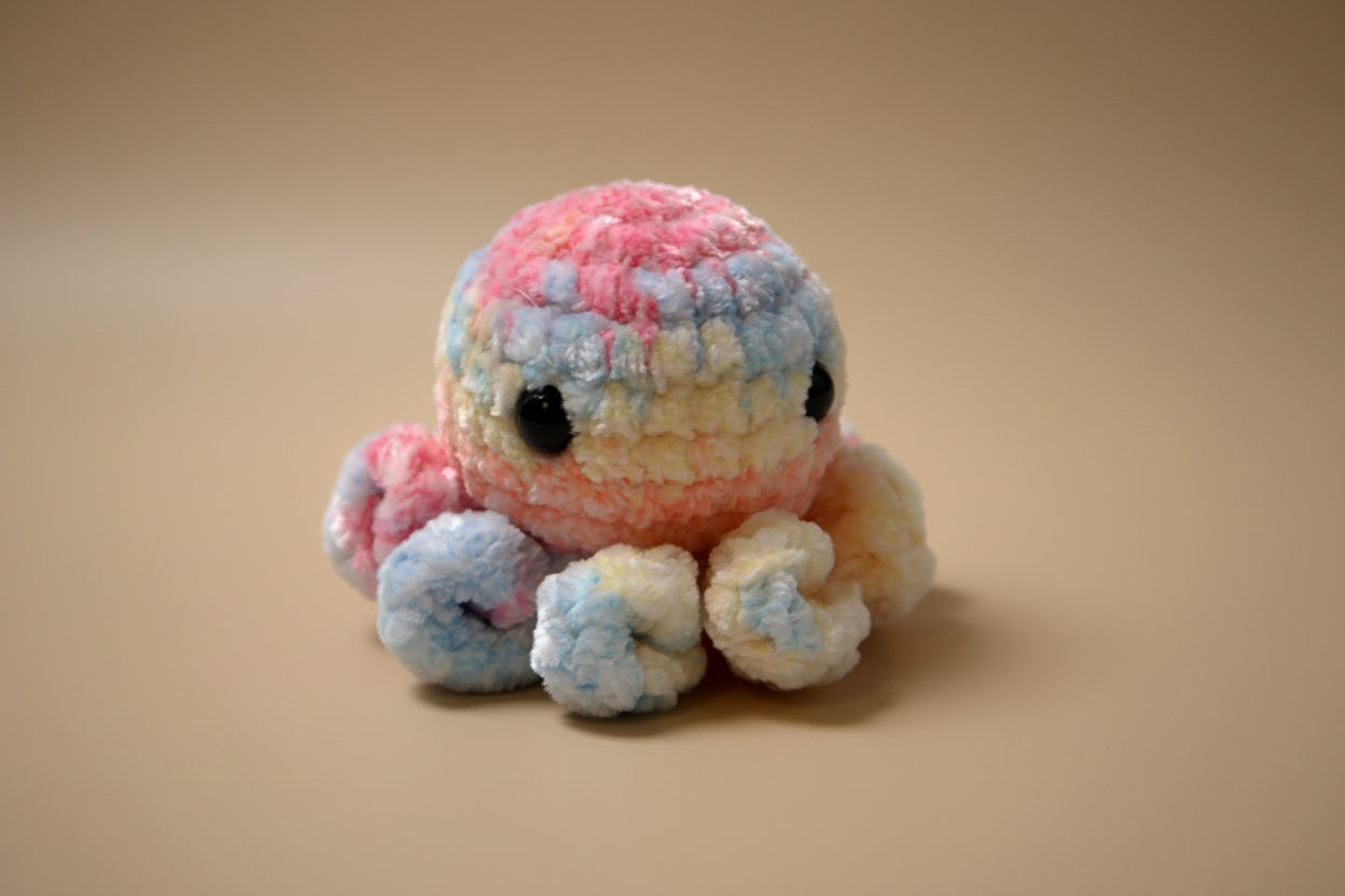 Handmade crochet mini octopus desk charm from the amigurumi marine life collection of the baseline handicraft, crafted in France with love. 