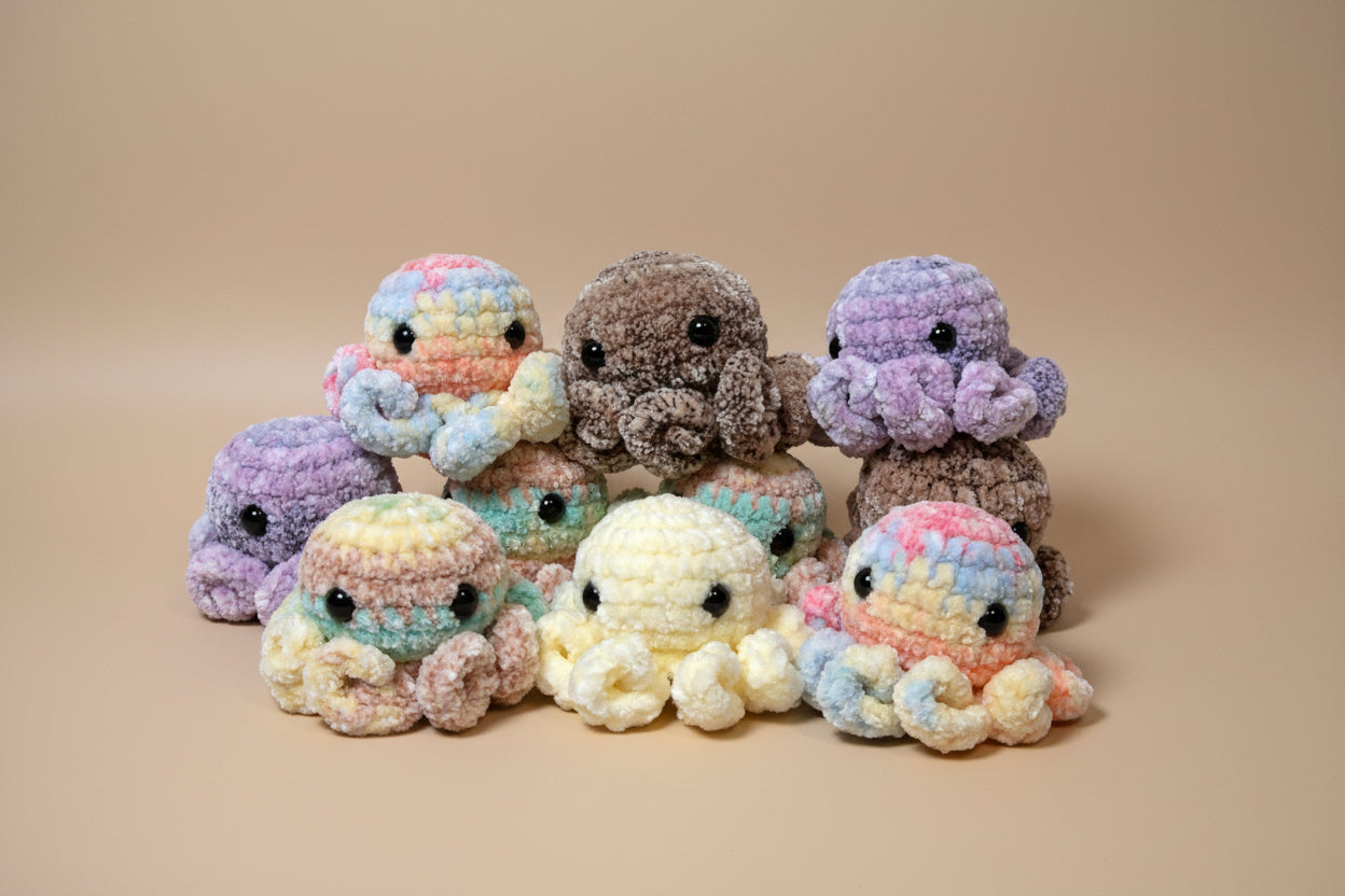 Handmade crochet mini octopus desk charm from the amigurumi marine life collection of the baseline handicraft, crafted in France with love. 