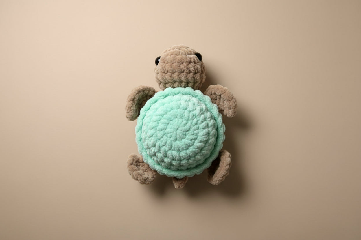 Handmade crochet mini turtle plushie from the amigurumi marine life collection of the baseline handicraft, crafted in France with love. 