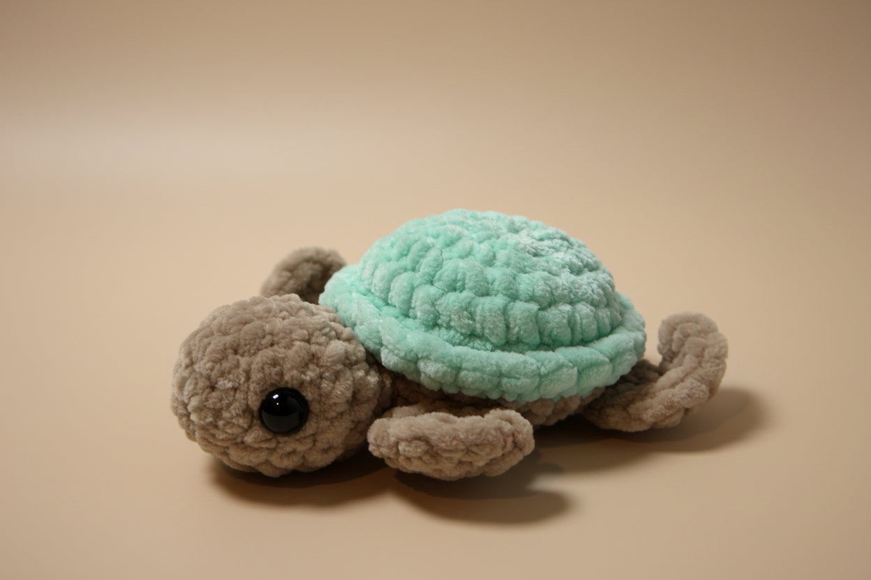 Handmade crochet mini turtle plushie from the amigurumi marine life collection of the baseline handicraft, crafted in France with love. 