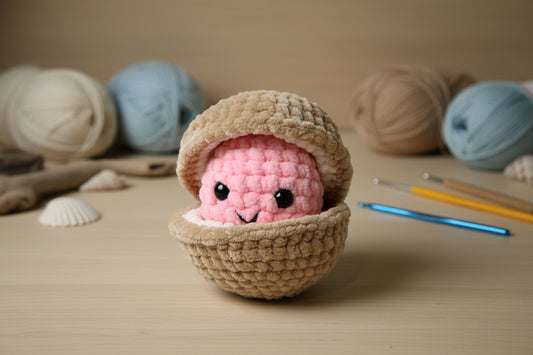 Handmade crochet pearl clam plush from the marine life collection of the baseline handicraft, crafted in France. 