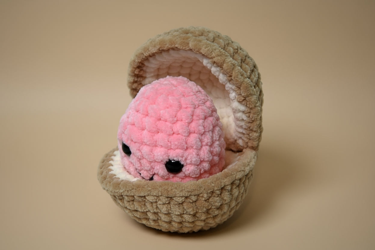 Handmade crochet pearl clam plush from the marine life collection of the baseline handicraft, crafted in France. 