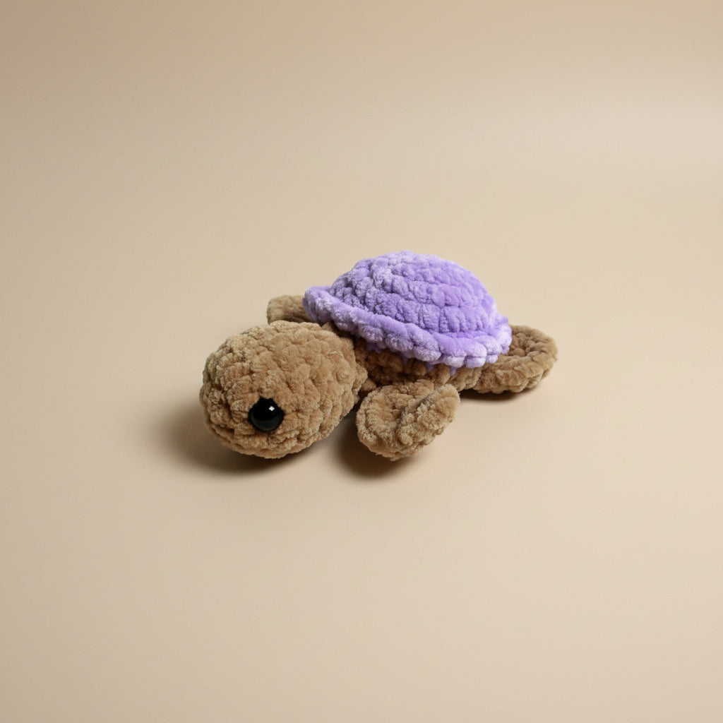 Handmade crochet mini turtle plushie from the amigurumi marine life collection of the baseline handicraft, crafted in France with love. 