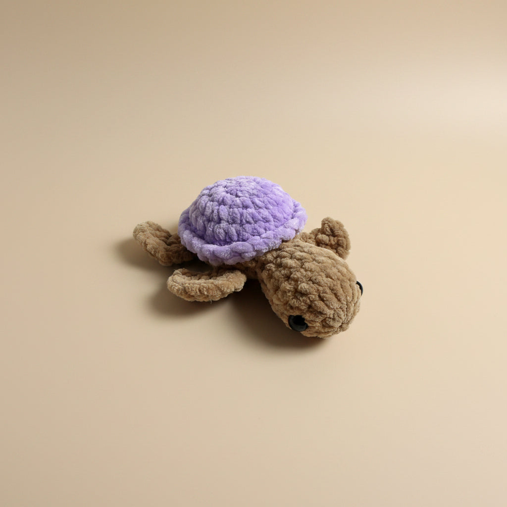 Handmade crochet mini turtle plushie from the amigurumi marine life collection of the baseline handicraft, crafted in France with love. 