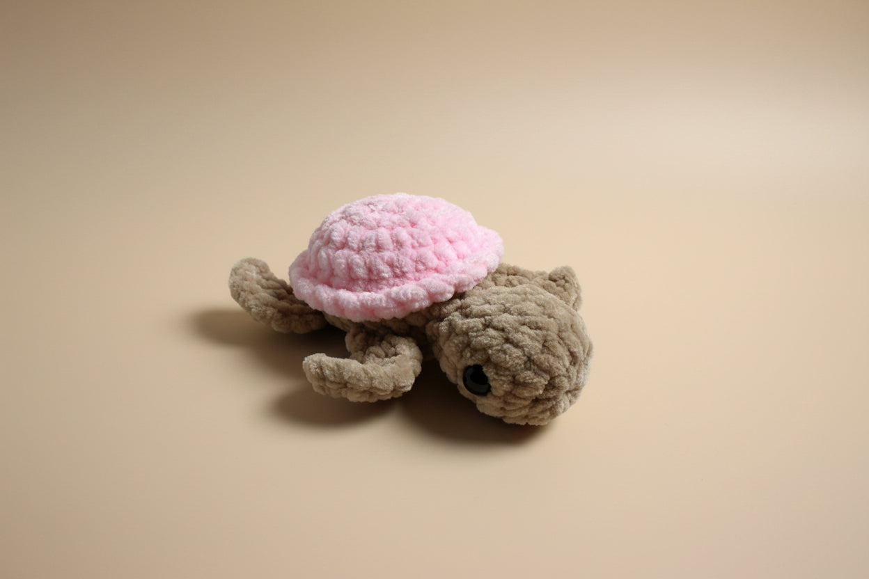 Handmade crochet mini turtle plushie from the amigurumi marine life collection of the baseline handicraft, crafted in France with love. 
