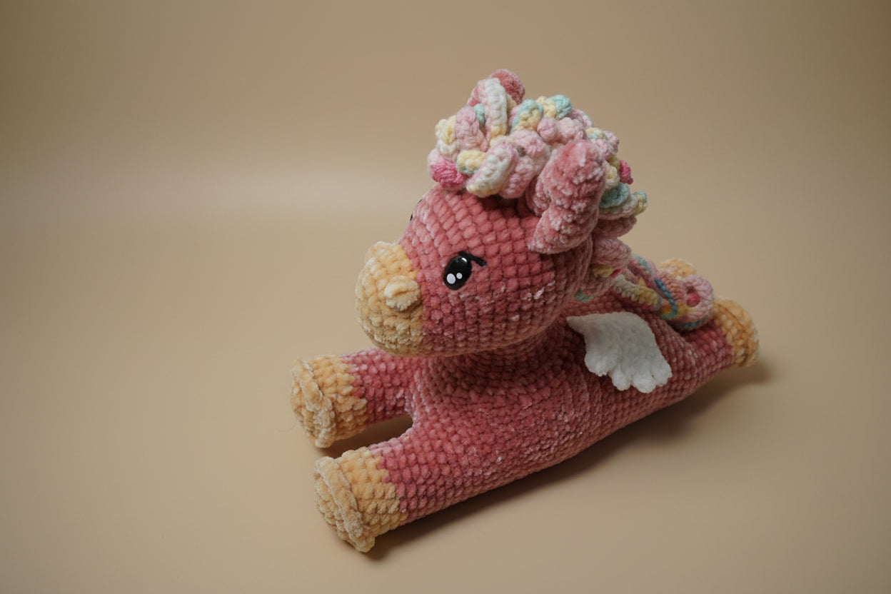 Handmade crochet twinkle peagasus from the amigurumi collection of the baseline handicraft, crafted in France with love.